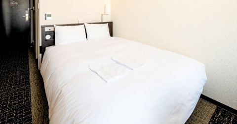 画像：アクセス清潔感を重視したデュベスタイルのベッド